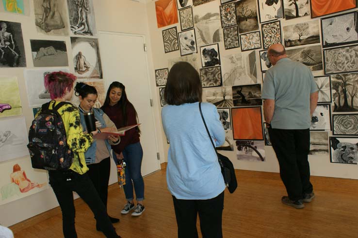 People enjoying the Student Art Exhibit