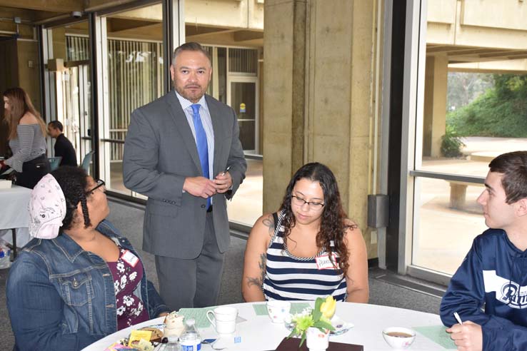 People enjoying Tea With the Deans