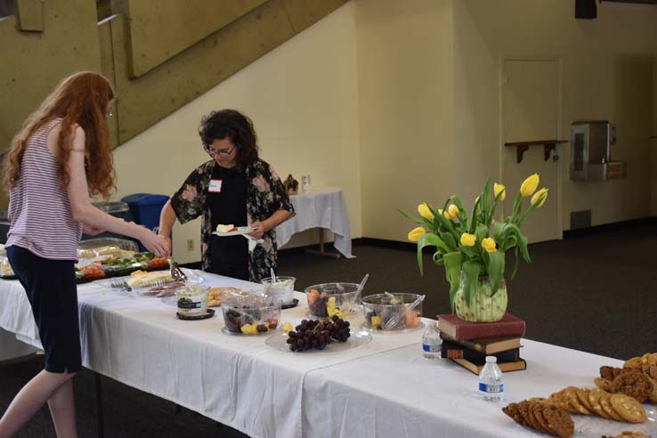 People enjoying Tea With the Deans