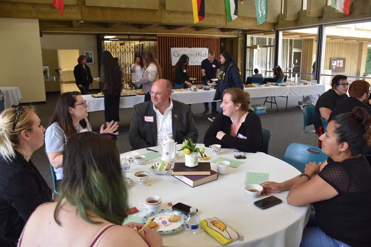 People enjoying Tea With the Deans