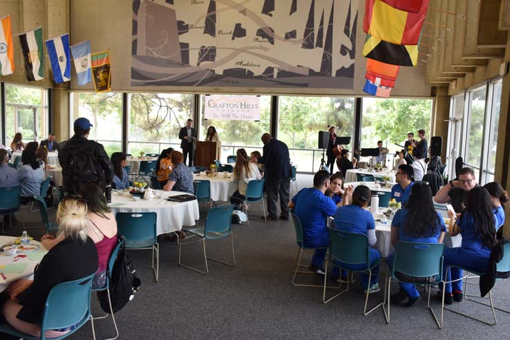 People enjoying Tea With the Deans