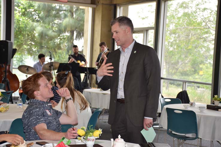 People enjoying Tea With the Deans