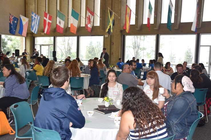 People enjoying Tea With the Deans