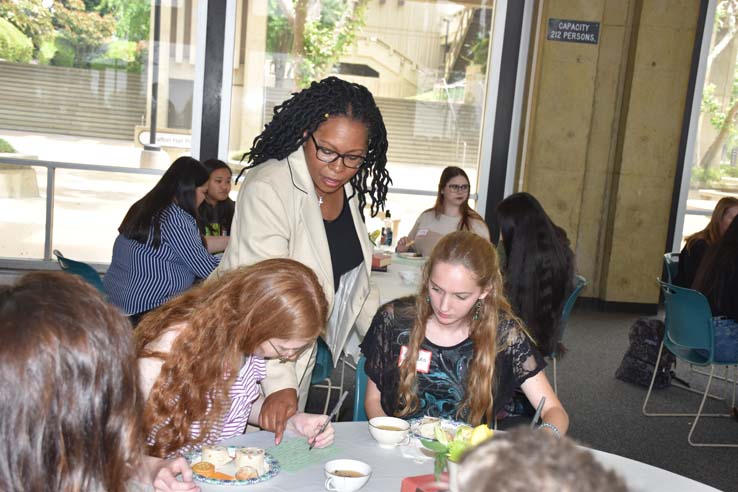 People enjoying Tea With the Deans