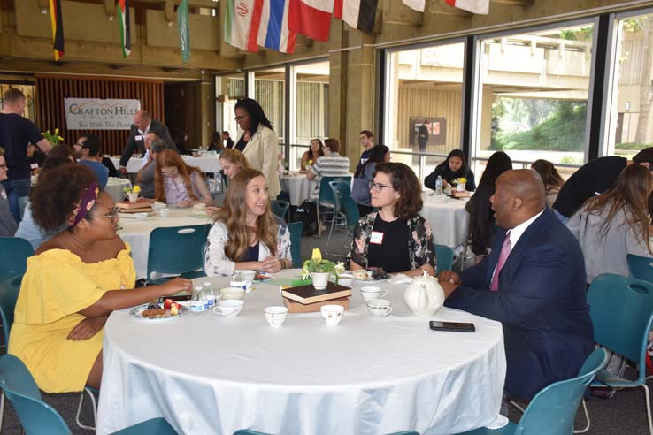 People enjoying Tea With the Deans