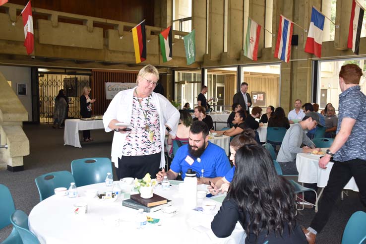 People enjoying Tea With the Deans