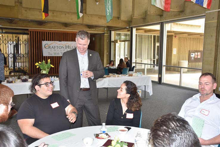 People enjoying Tea With the Deans