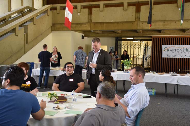 People enjoying Tea With the Deans