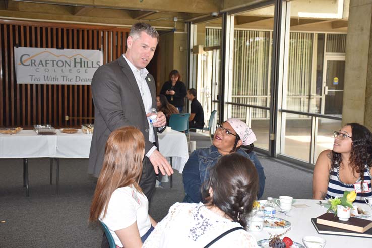 People enjoying Tea With the Deans