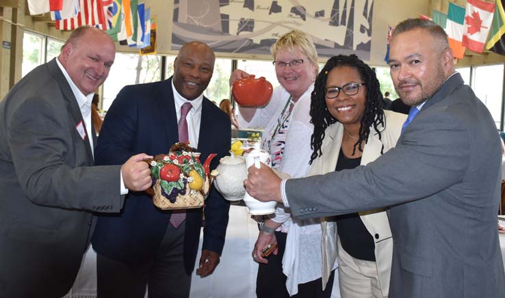 People enjoying Tea With the Deans