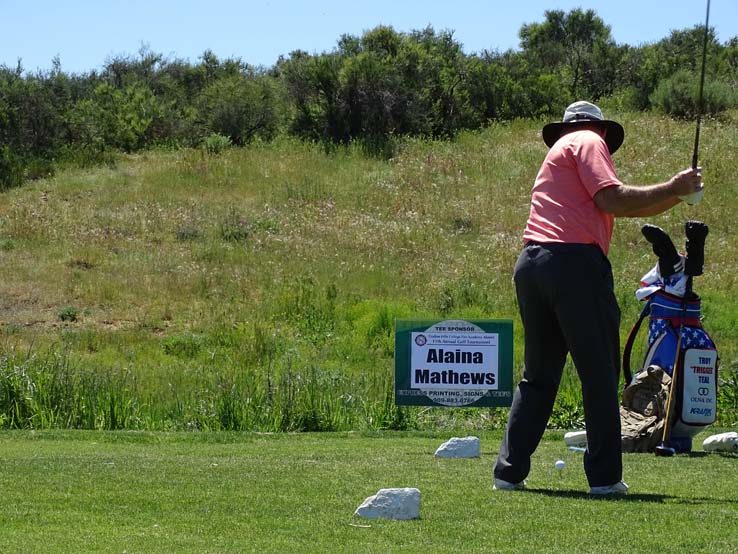 People enjoying the Fire Academy Golf Tournament