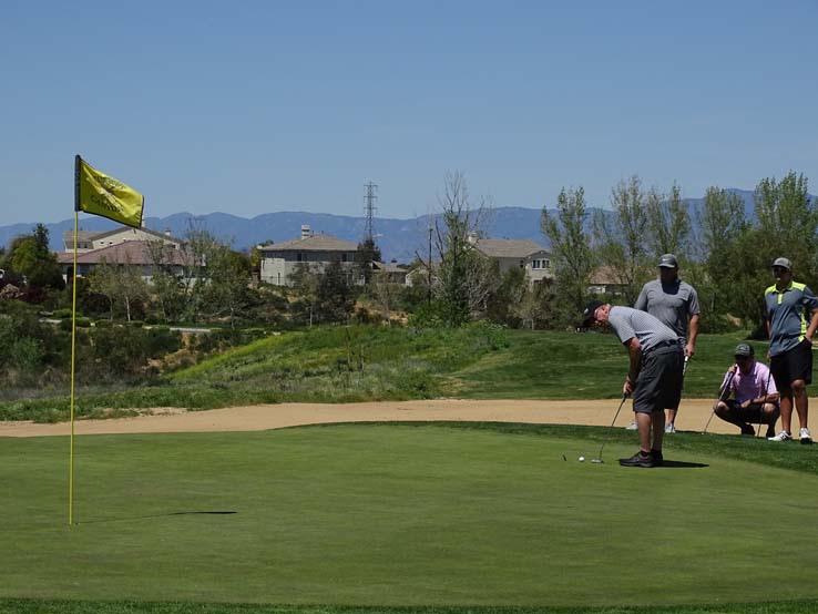 People enjoying the Fire Academy Golf Tournament