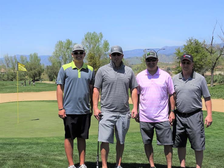 People enjoying the Fire Academy Golf Tournament