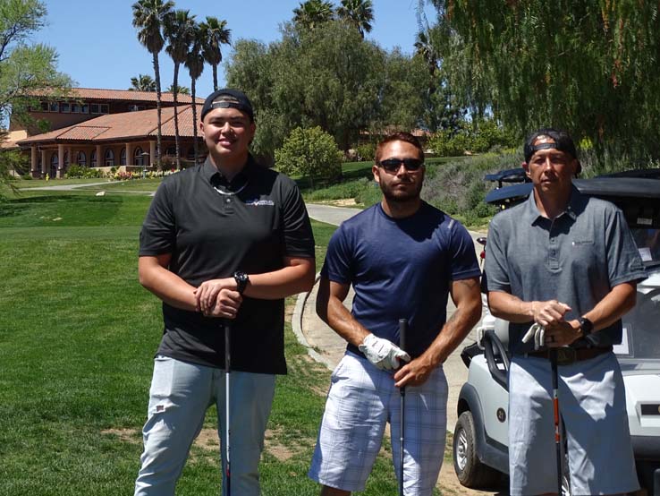 People enjoying the Fire Academy Golf Tournament