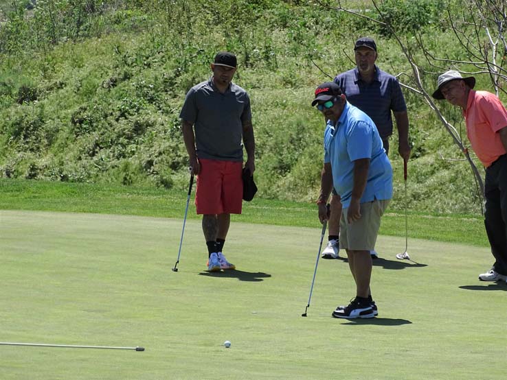 People enjoying the Fire Academy Golf Tournament