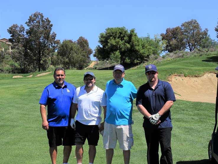 People enjoying the Fire Academy Golf Tournament