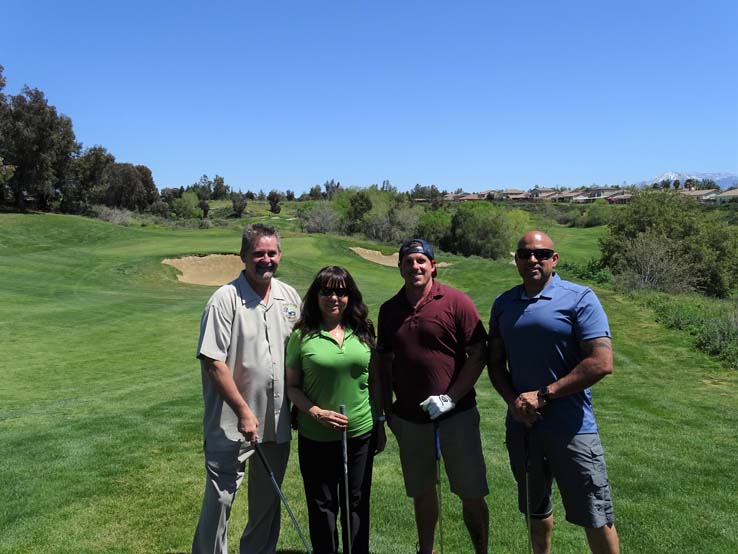 People enjoying the Fire Academy Golf Tournament