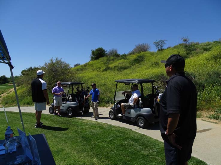 People enjoying the Fire Academy Golf Tournament