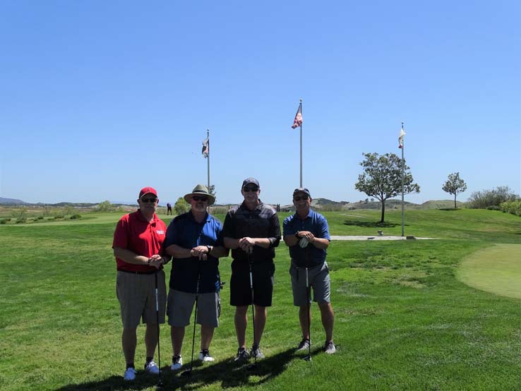 People enjoying the Fire Academy Golf Tournament