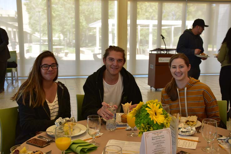 Students enjoying the grad breakfast