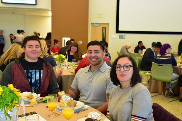 Students enjoying the grad breakfast