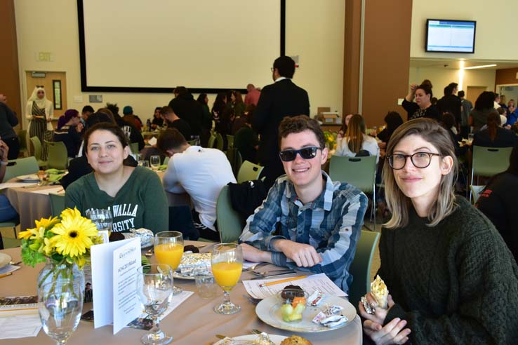 Students enjoying the grad breakfast