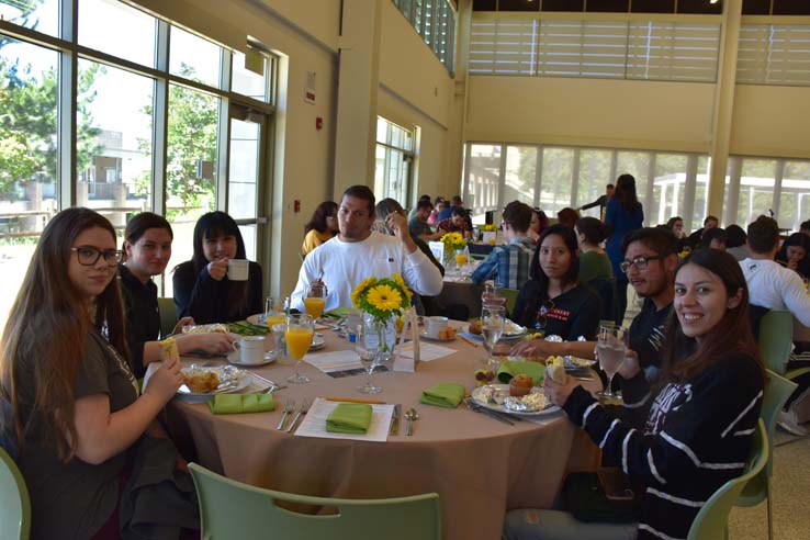 Students enjoying the grad breakfast