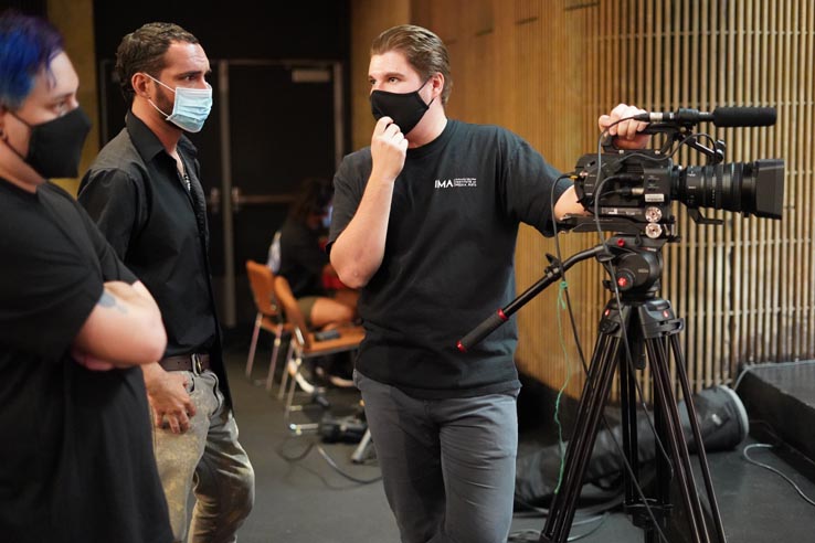 Theatre students wearing protective masks