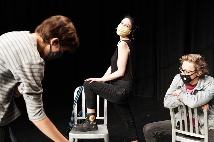 Theatre students wearing protective masks