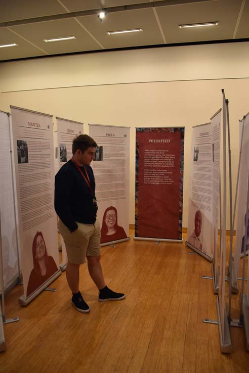 A student browsing the gallery at the event.