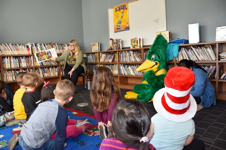 Children and Crafton Roadrunner Mascot enjoying Read Across America event