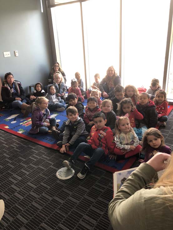 Children and Crafton Roadrunner Mascot enjoying Read Across America event