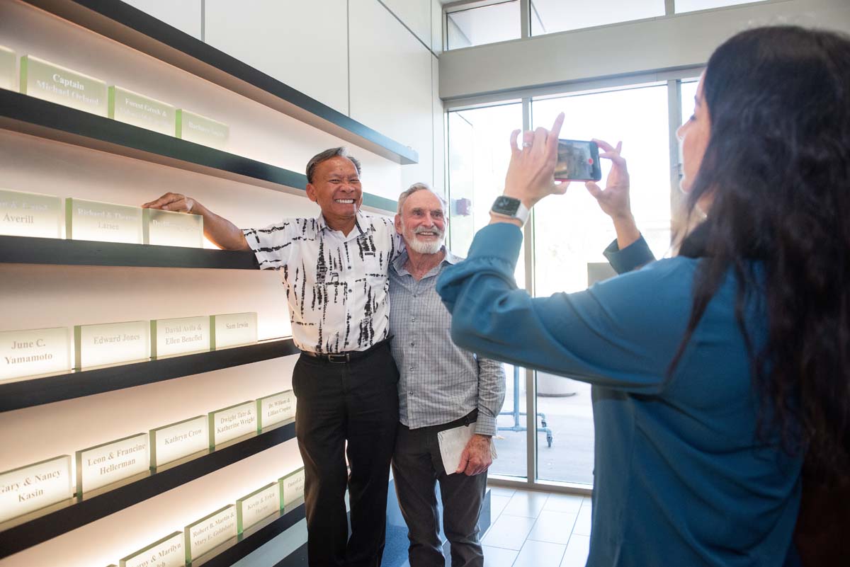 This is a sample image caption.People enjoying the Legacy Wall unveiling