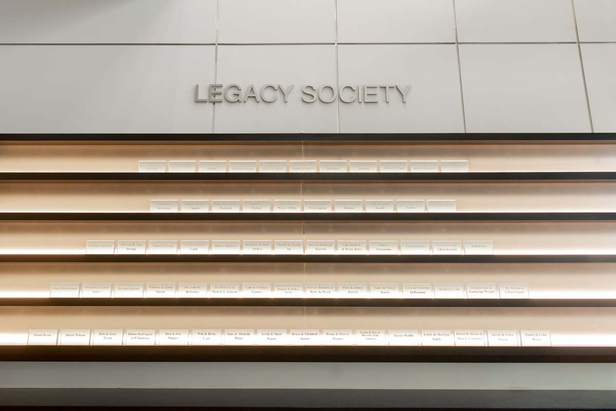 This is a sample image caption.People enjoying the Legacy Wall unveiling