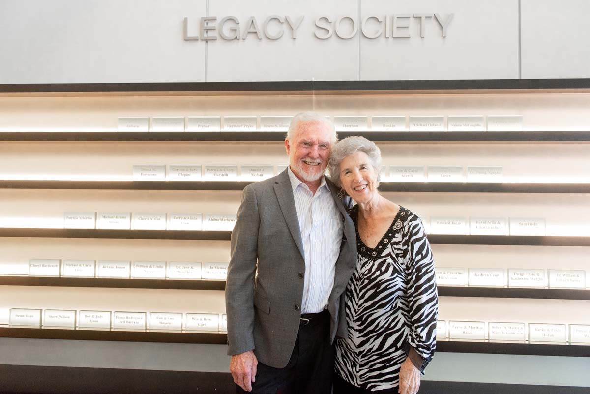 This is a sample image caption.People enjoying the Legacy Wall unveiling