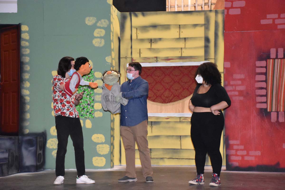 Performers at an Avenue Q rehearsal