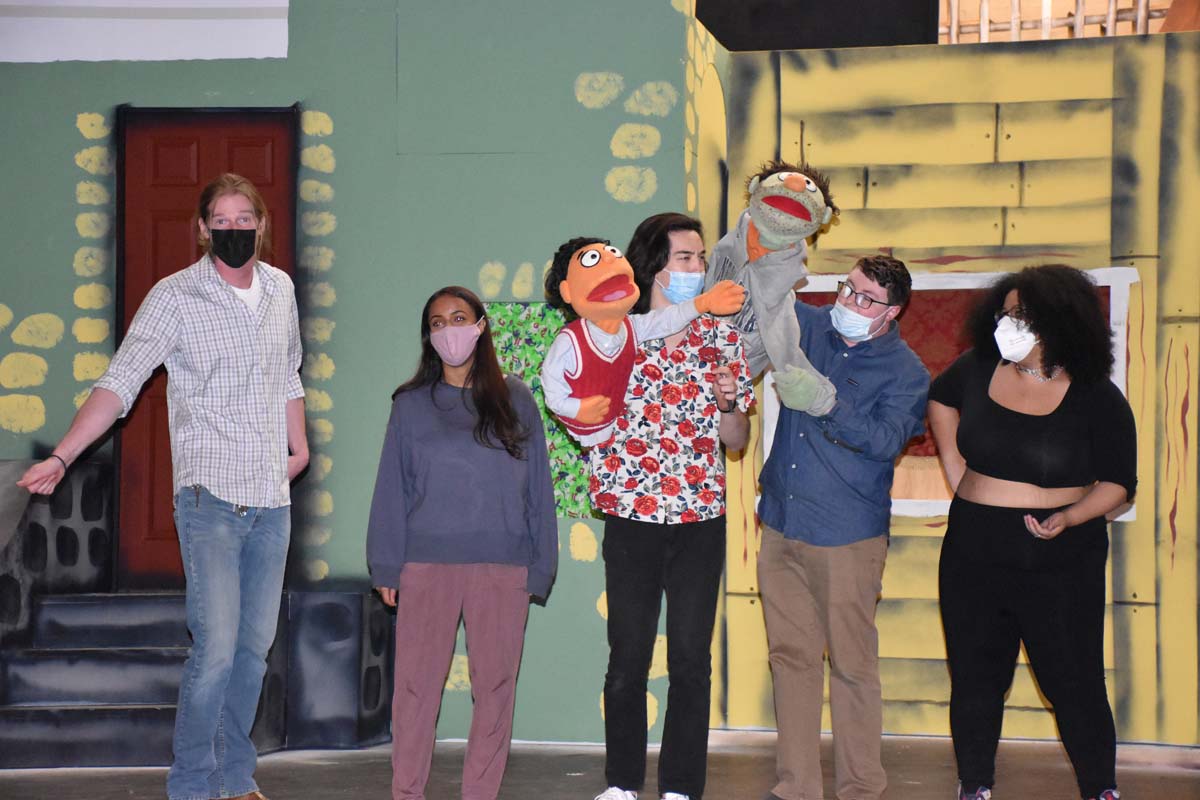 Performers at an Avenue Q rehearsal