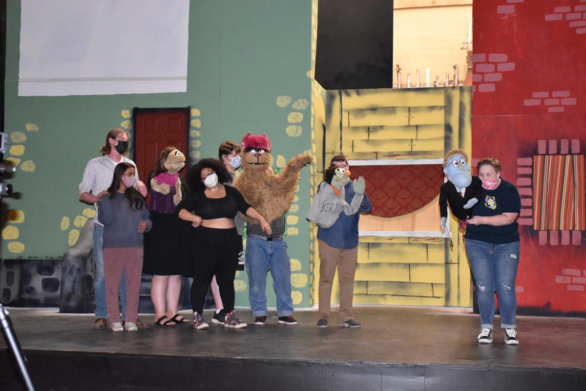 Performers at an Avenue Q rehearsal