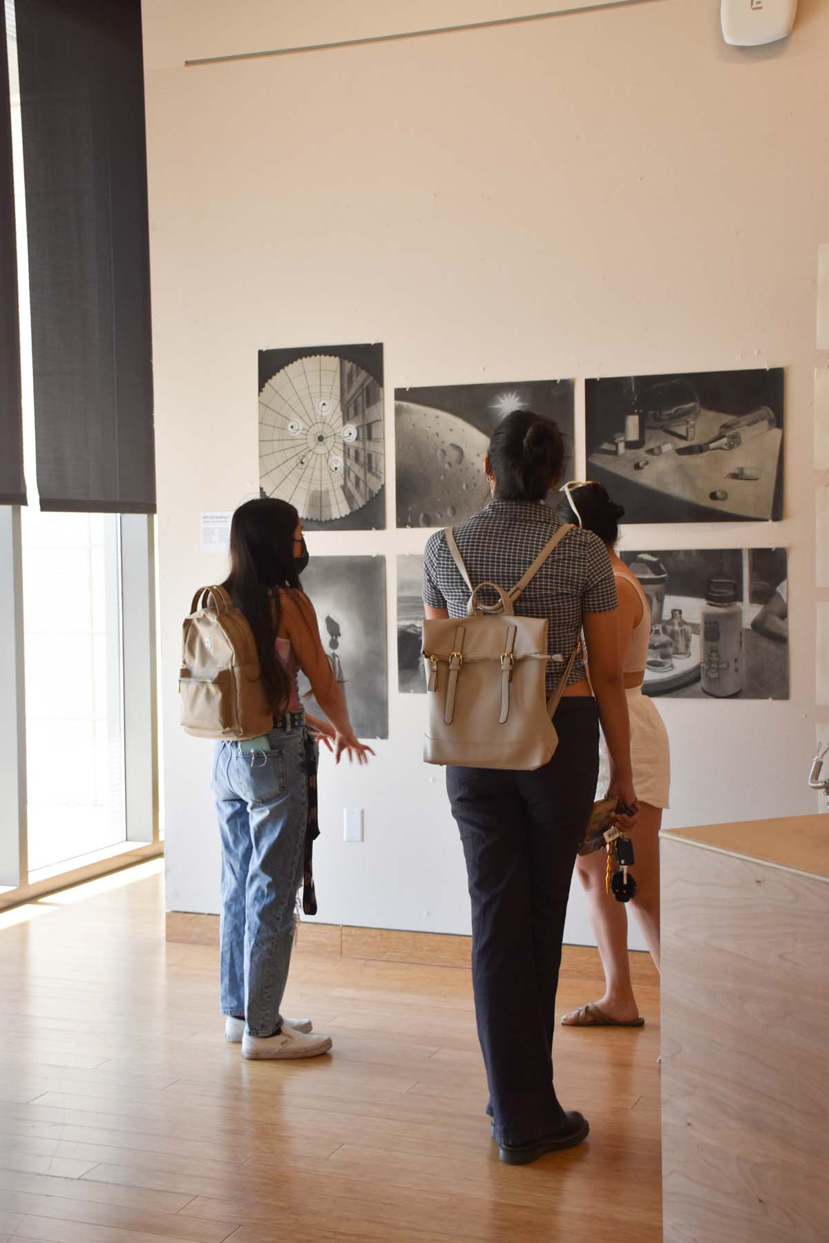 People enjoying the Student Art Exhibit