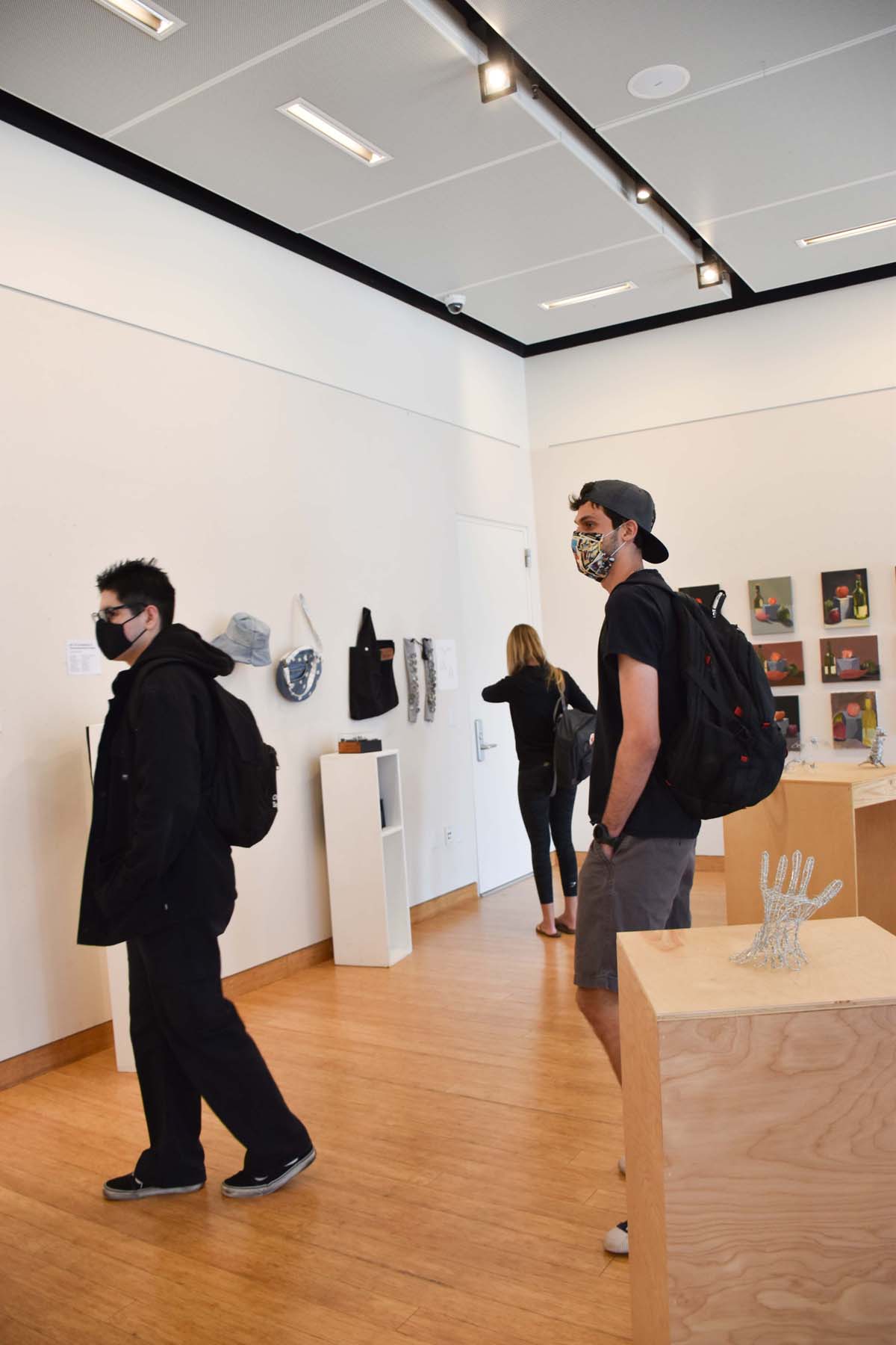 People enjoying the Student Art Exhibit