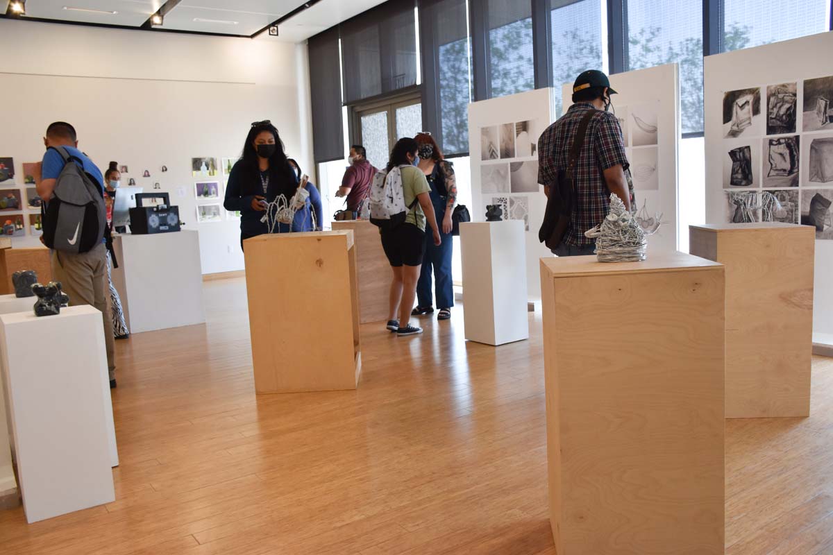 People enjoying the Student Art Exhibit