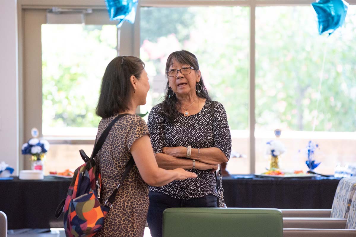 People enjoying the Paramedic Alumni Reception