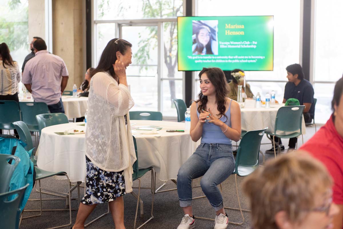 People enjoying the Scholarship Reception