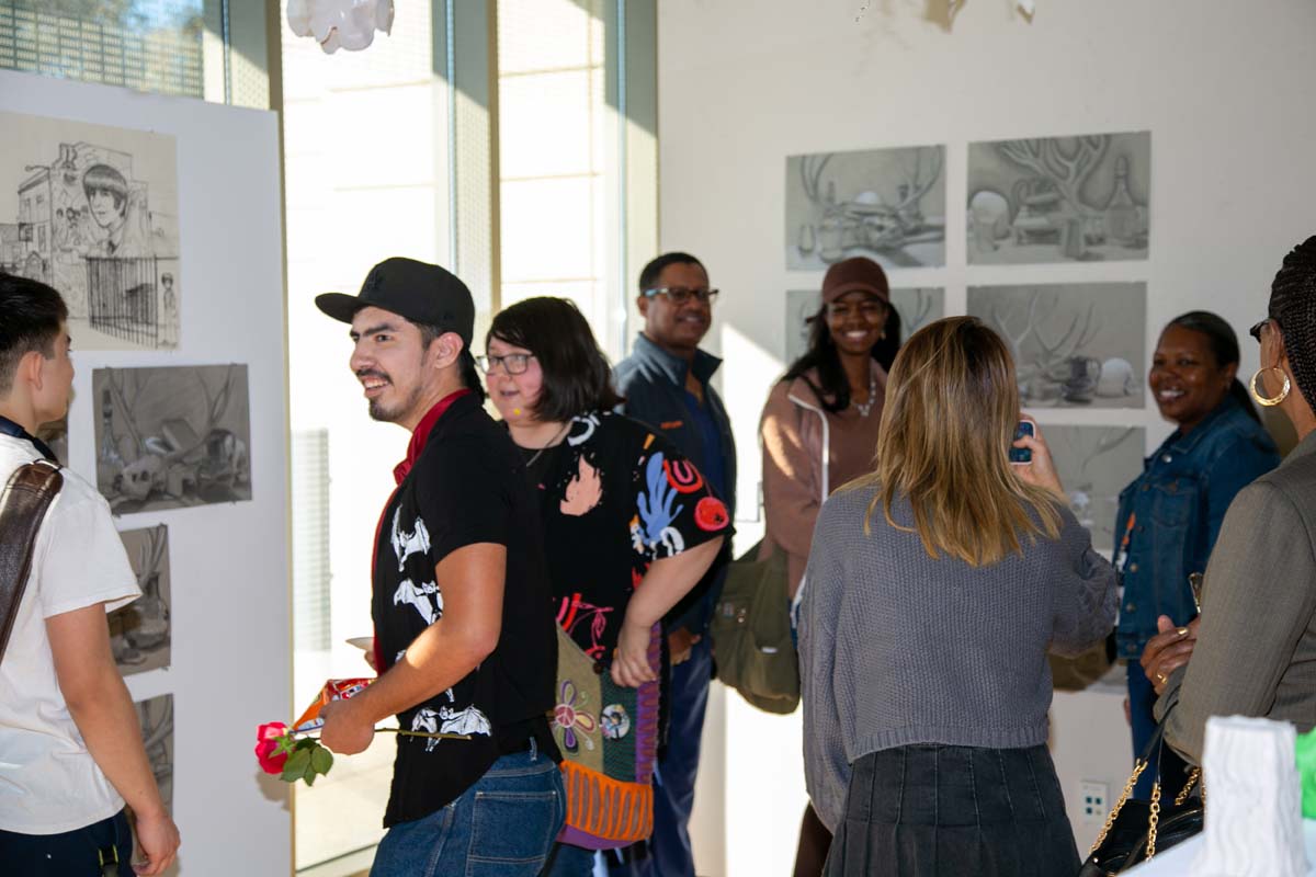 People enjoying the Student Art Show