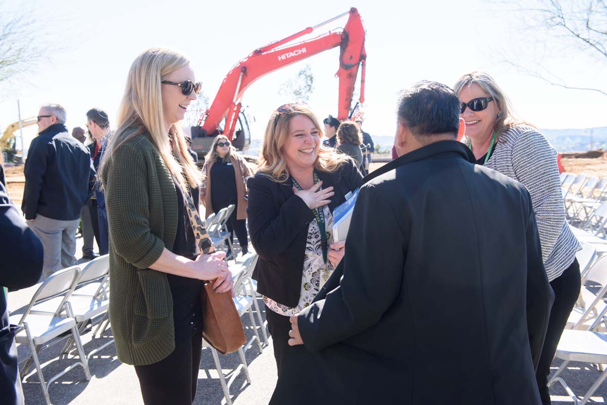 People enjoying the groundbreaking ceremony