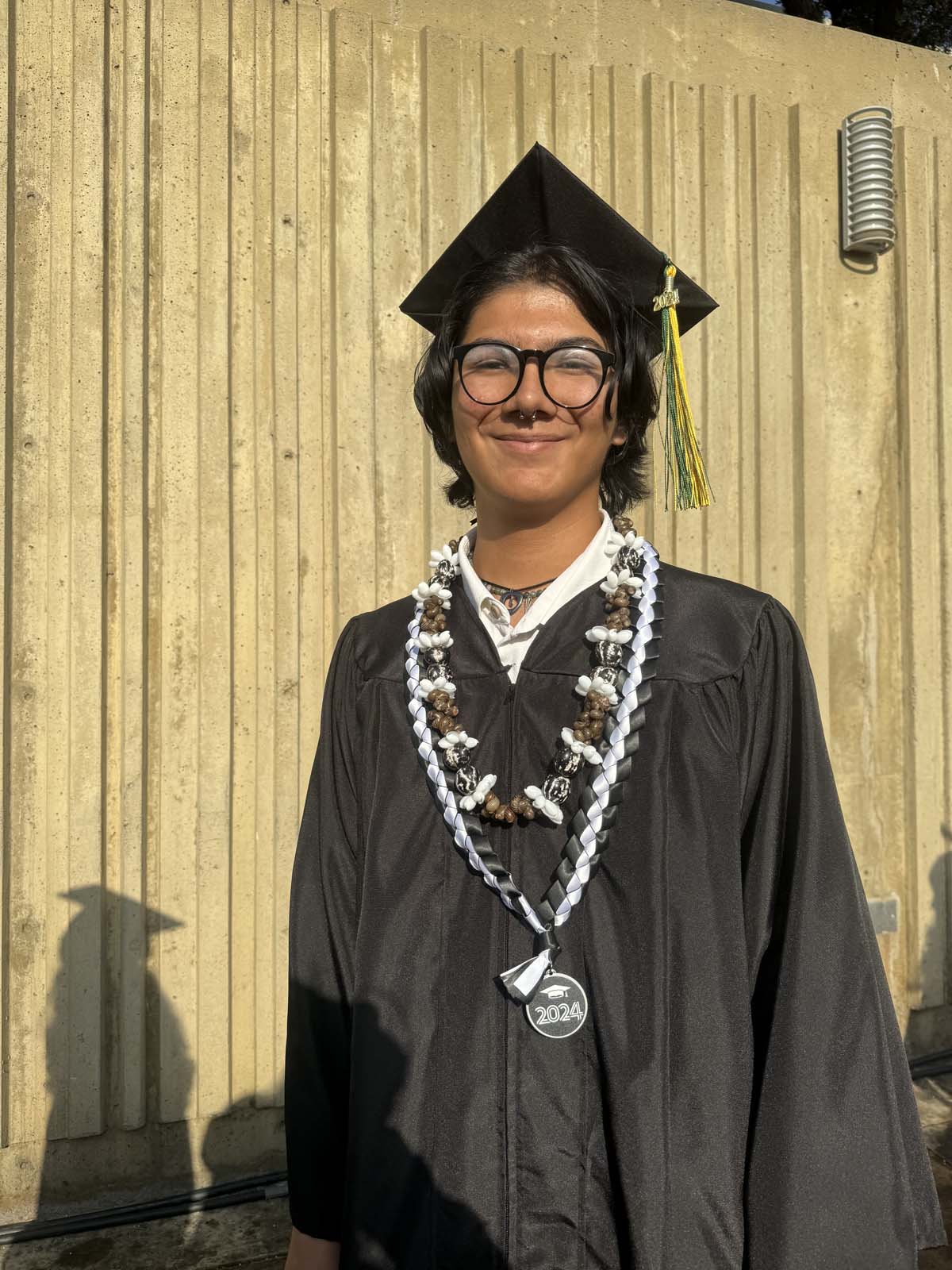 Graduates walk to stage at CHC's Commencement 2024.