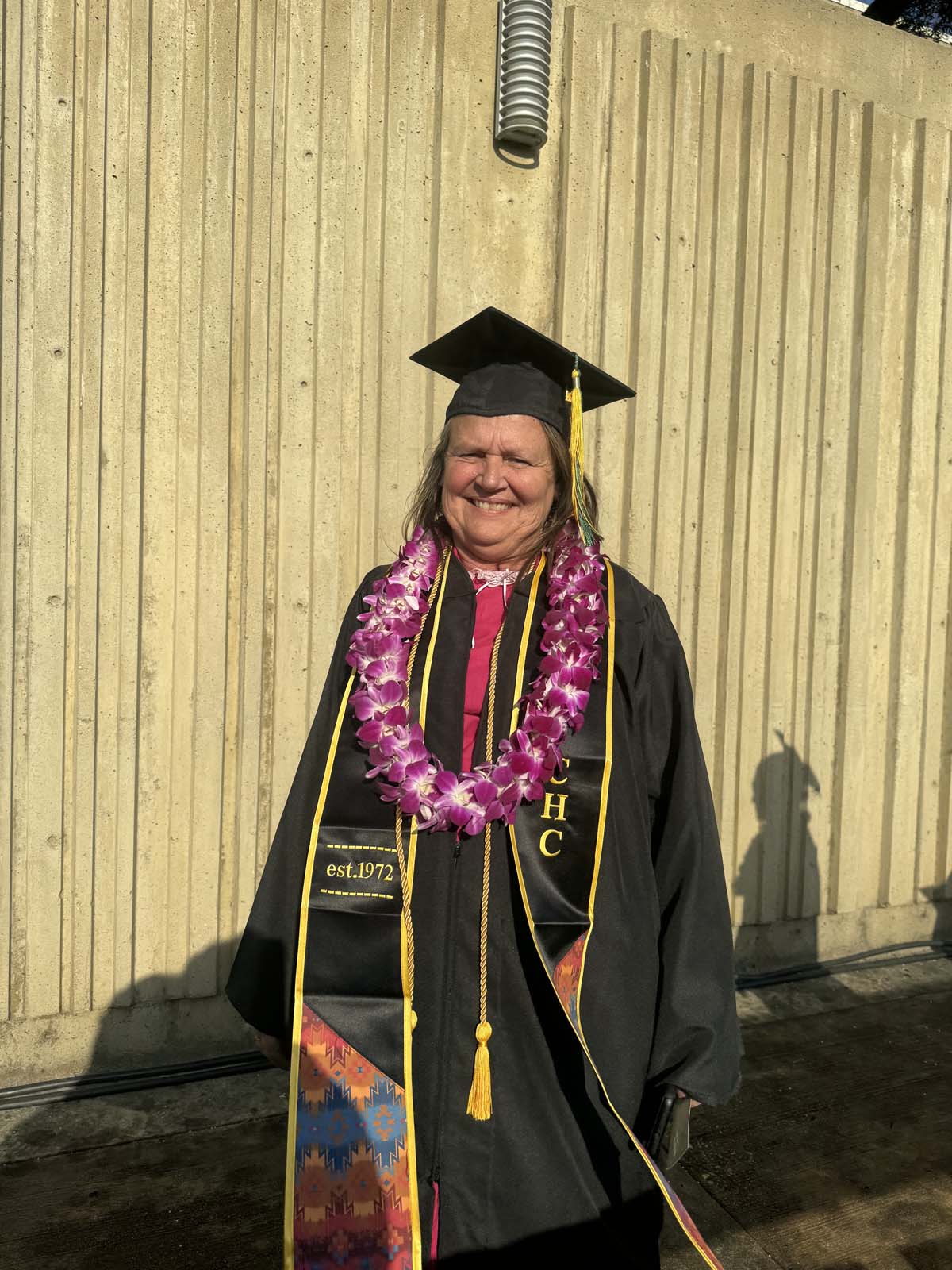 Graduates walk to stage at CHC's Commencement 2024.