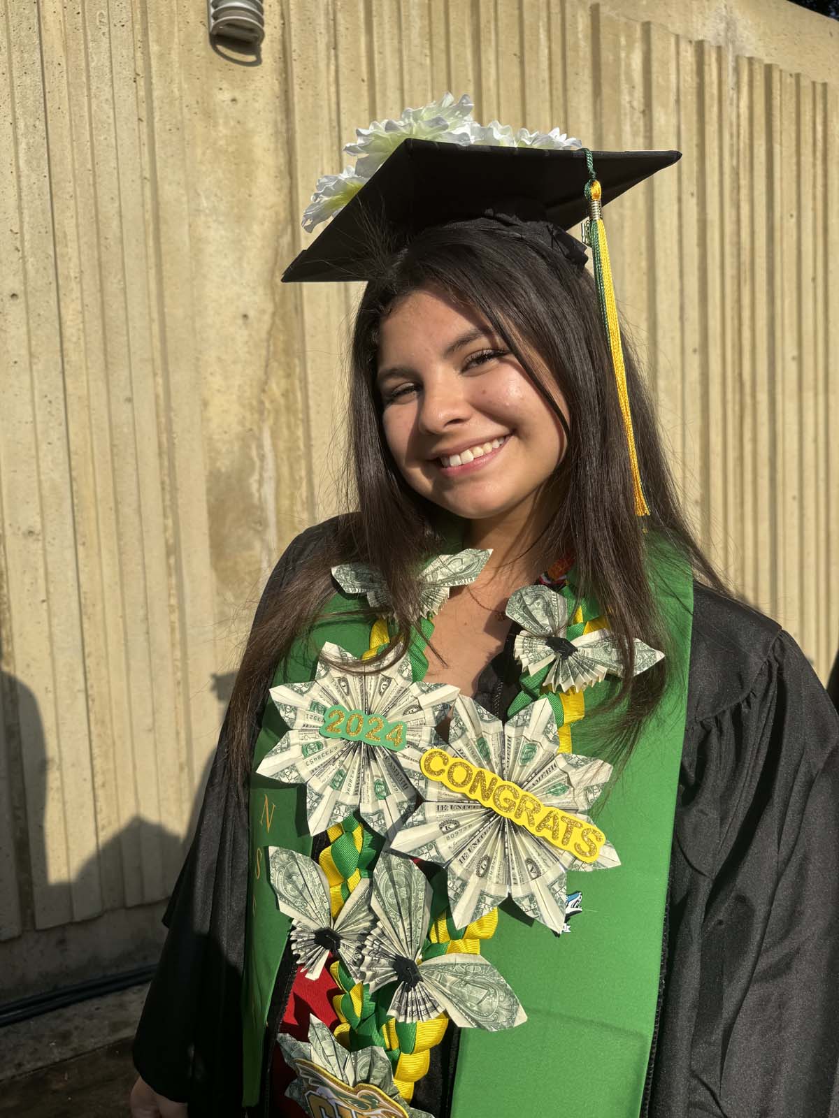 Graduates walk to stage at CHC's Commencement 2024.