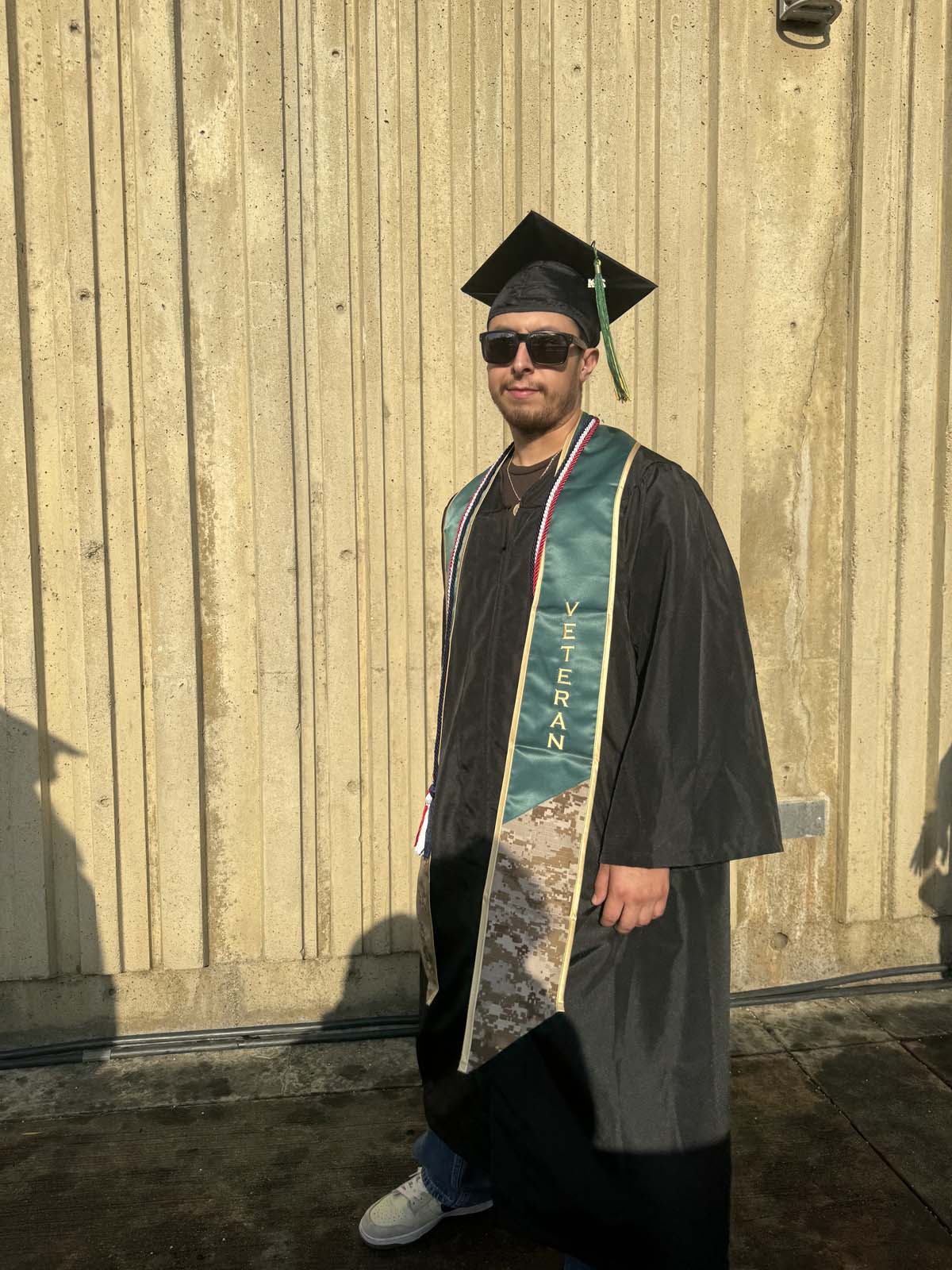 Graduates walk to stage at CHC's Commencement 2024.