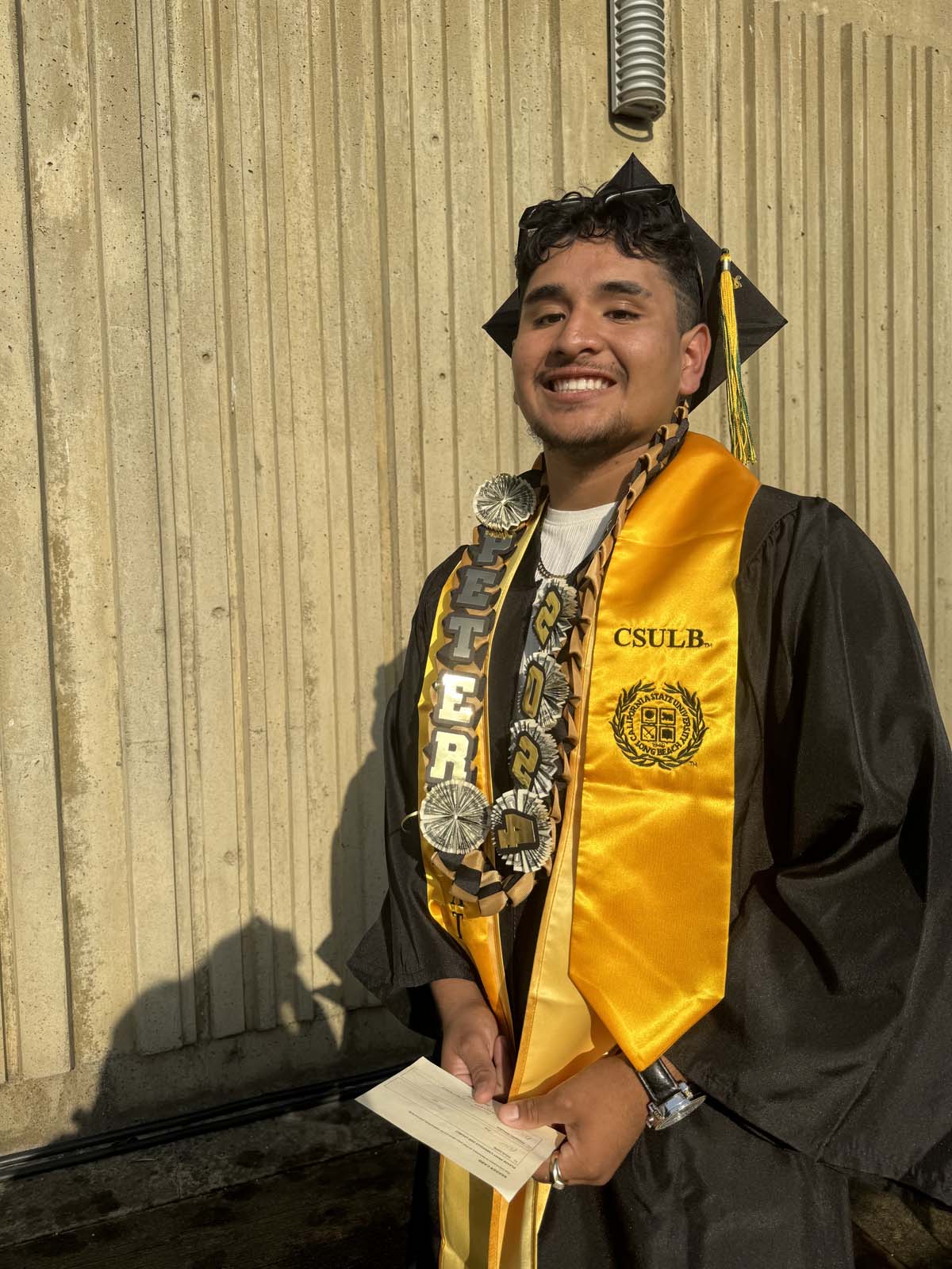 Graduates walk to stage at CHC's Commencement 2024.